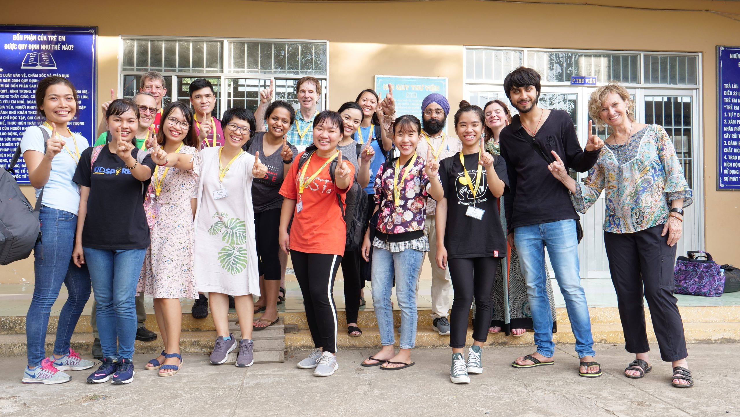 Cadence volunteers and Kidspire Vietnam students pose as a group celebrating STEAM innovation