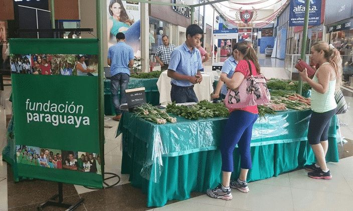 Farmers market with sign for fundacion paraguaya