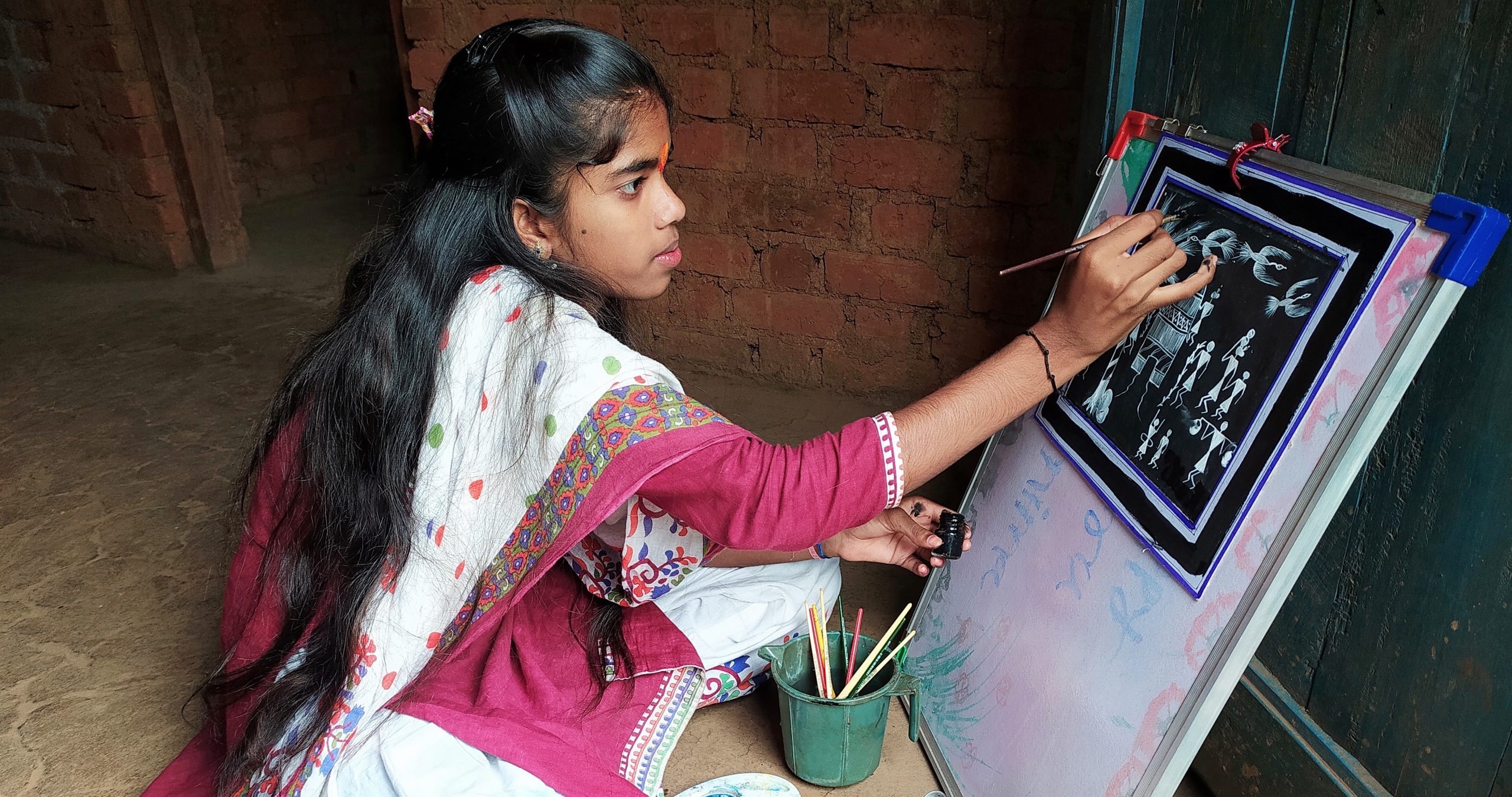 Child making art. Learning Links Foundation supports students and teachers through professional development opportunities in India.