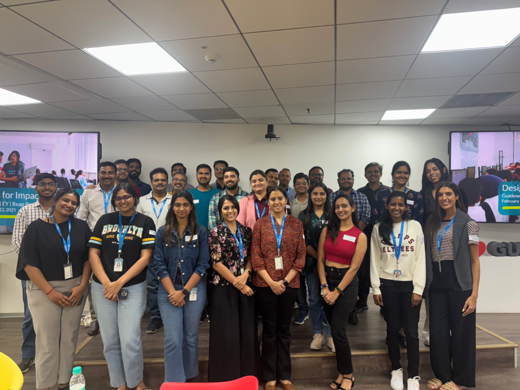 Team4Tech Design for Impact Workshop volunteers from EY and Guidewire pose for a photo on-site in Bengaluru